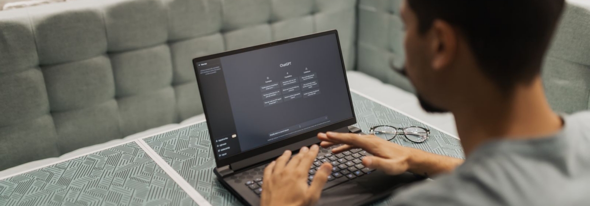 Business owner comparing software options on a laptop