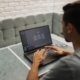 Business owner comparing software options on a laptop