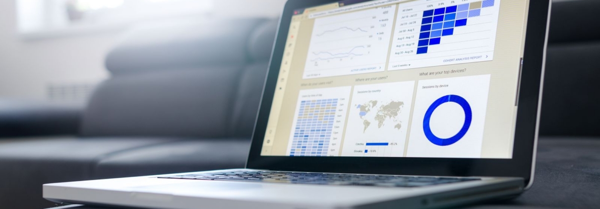 Laptop showing a business dashboard with charts