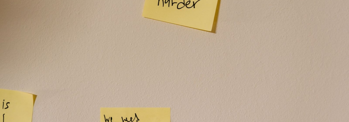 Sticky notes on a wall used to decide what to fix first in a business